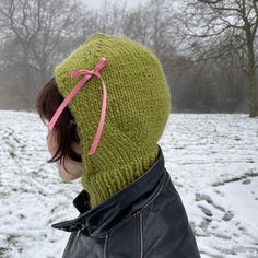 The bow balaclava is your answer to staying girly and coquette this Winter. This bonnet uses chunky yarn so it knits up quickly, then you can accessorise as you see fit with ribbons, bows and charms.  Sister pattern: Bow wrist warmers! These are knitted in the same yarn and same sized needles as the bonnet. So cast off the bonnet and then make yourself a matching pair of gloves! Check out my shop for the wrist warmer pattern.  MATERIALS -X2 balls of 50m, 50g chunky yarn  -Ribbon adornment of you Knitted Cap Bonnet, Cute Knitted Bonnet Cap, Winter Knit Cap Bonnet, Knitted Winter Bonnet Cap, Knit Balaclava Pattern, Balaclava Knitting Pattern, Balaclava Knitting, Balaclava Knit, Pink Knitted Bonnet Cap