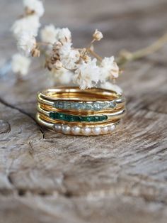 Hidden Gem Ring in Gold// Gardens of the Sun- Ethical Jewelry People have bought them as engagement rings, wedding bands, stacking rings, purity ring, birthday gifts and more and more moms stack them as mothers' rings to celebrate motherhood and represent their children.  #Wedding #Rings #EngagementRings #GoldRings Everyday Yellow Gold Stackable Rings With Gemstones, Stackable Yellow Gold Gemstones For Gift, Everyday Gemstone Ring For May Birthstone, Heirloom Yellow Gold Stackable Emerald Ring, Heirloom Stackable Emerald Ring In Yellow Gold, 14k Yellow Gold Pearl Ring With Gemstone, Gold Emerald Ring With Gemstone Accents, May Birthstone Yellow Gold Ring, Yellow Gold Rings With May Birthstone