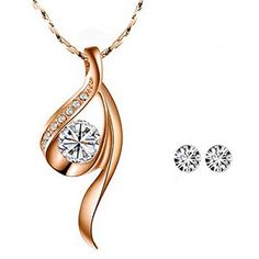 The unique and elegant design of this crystal necklace is eye-catching and beautiful. This necklace is truly a classic piece of jewelry that will go great with all outfits. Pair the necklace with an elegant evening gown as the perfect finishing piece, or wear the necklace to dress up a casual outfit. Necklace Dimensions: Pendant 1.06" x 0.5", 16" chain with 2.25" extendable chain. Necklace Material: Tin Alloy. Earrings Dimensions: 0.19 inch in diameter. Earrings Material: Crystal Elegant Evening Gown, Earring Jewelry Box, Lace Tape, Baby Hair Accessories, Spa Gifts Set, Alloy Earrings, Anklet Bracelet, Jewelry Stand, White Crystal