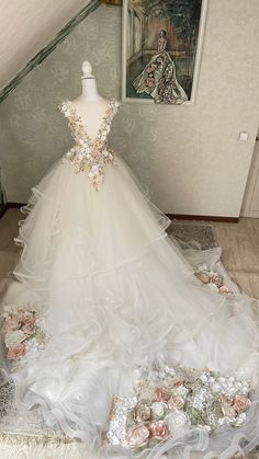 a wedding dress on display in a room