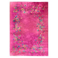 a pink rug with colorful flowers on it