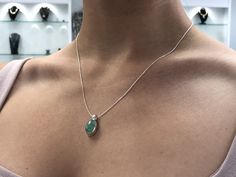 Featured here is a stunning, cabochon oval Colombian emerald necklace in fine .925 sterling silver. Displayed is a light-green emerald bezel set in an elongated silver setting. The earth mined, green Colombian emerald has a light green color with good clarity. An 18 inch chain is included with the emerald pendant. This is an excellent gift for a May baby or for someone who simply loves emeralds. Total Carat Weight: 5.0cts Setting Style: Bezel Setting Material: .925 Sterling Silver Main Stone: Co Sterling Silver Oval Pendant Fine Jewelry, Fine Jewelry Sterling Silver Oval Pendant, Oval Cabochon Sterling Silver Gemstones, Gift Oval Cabochon Necklace With Polished Finish, Oval Cabochon Emerald Fine Jewelry, Green Oval Cabochon Gemstone Necklace, Formal Emerald Jewelry With Oval Cabochon, Formal Oval Cabochon Emerald Jewelry, Polished Finish Oval Cabochon Necklace