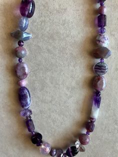 This design will be perfect with any part of a wardrobe of anyone who loves purple or pink. Amethyst,Fluorite, Agate and Vintage Glass make it interesting any time its worn. 18' to 21" adjustable with silver chain.The largest beads are 1/2" wide and 1" long. Luxury Purple Crystal Necklaces With Gemstone Beads, Elegant Purple Necklaces With Faceted Beads, Luxury Purple Gemstone Beads Crystal Necklace, Luxury Purple Jewelry With Faceted Beads, Purple Amethyst Crystal Necklaces With Faceted Beads, Elegant Purple Agate Beaded Necklace, Purple Amethyst Necklace With Faceted Beads, Purple Agate Spiritual Beaded Necklace, Pink Amethyst