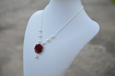 "Featuring 25mm Hand Sculpted Deep Red (Garnet) Rose and pearls Centered Necklace. Matching Red Rose Earrings: https://www.etsy.com/listing/165095225/red-rose-and-pearls-earrings-dangle-rose?ref=shop_home_active Note : Drop a note if you prefer Fired red rose or Succulent Rose, otherwise will be shipped as Garnet Red Rose. Material and size : Rose Clay Flower is approximately 25-26mm across. 6-8mm Ivory /cream/Off-white glass pearls. White pearls available. Swarovski available with additional co Red Rose Jewelry, Jordan Gift, Red Rose Earrings, Red Flower Necklace, Necklace Matching, Garnet Red, Clay Flower, Sugar Land, Necklace Red