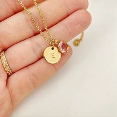 Birthstone necklace for women in gold-tone stainless steel consisting of a 12mm medallion personalized by hand with the initial and 8mm birthstone of your choice (1 character per medallion). ♡ DETAILS * Material: Gold stainless steel * Necklace length: 45 cm + 5 cm extension chain * Character height: 3 mm * Character type: Uppercase * Clasp: Carabiner ♡ CARE TIPS We advise you to avoid contact with water, perfume and chemicals to ensure long life. ♡ PROCESSING & DELIVERY Orders are processed and Woman In Gold, Necklace Initial, Letter Pendants, Necklace Personalized, Steel Necklace, Birthstone Necklace, Stainless Steel Necklace, Personalized Necklace, Name Necklace