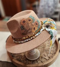 Felt/wool hat hand burned with cowgirl boots and sunflower pattern. Hand colored and hand made beaded and fabric sunflower band. Adjustable and nice quality. beautiful soft heathered tan color ... fun for any event, awesome gift! Rustic Brimmed Hat For Spring, Country Style Fedora For Kentucky Derby Festival, Vintage Hats For Ranch In Fall, Vintage Ranch Hats For Fall, Rustic Brimmed Felt Hat For Fall, Rustic Adjustable Hats For Fall, Rustic Hat For Fall Country Events, Vintage Fall Ranch Hat, Vintage Handmade Hats For Country Events