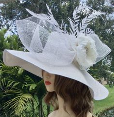 Step into the world of elegance ad tradition with this exquisite Ketucky Derby wide brim hat.  Handcafted with the finest materials, the hat boasts a wide brim that gracefully frames your face creating aura of sophication and charm.  Perfect for church, tea party or ay special occasion.  Available in several colors upon request. White Flower Wedding, White Fascinator, Tea Hats, Canvas Hat, Church Hat, Bridal Hat, Wedding Fascinators, Wide Brim Sun Hat, Elegant Hats