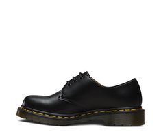 This is the Dr. Martens classic 3 eye shoe. The second style that they made, the shoe was crafted for industry — and made rebellious by generations of non-conformists. The 1461 is crafted with the same Doc's DNA as its 8-eye counterpart: grooved edges, yellow stitching and Smooth leather, a lightly textured, highly durable material with a soft sheen. It's built on our iconic, comfortable air-cushioned sole, that's oil and fat resistant, with good abrasion and slip resistance. Best of all, the so Classic Round Toe Oxfords For Streetwear, Classic Oxfords With Round Toe For Streetwear, Classic Lace-up Oxfords For Streetwear, Classic Leather Shoes With Leather Sole For Streetwear, Classic Leather Shoes With Rubber Sole For Streetwear, Dr Martens Store, Black Oxford Shoes, Dr Martens Womens, Black Dr Martens