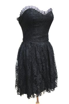 Beautiful black lace strapless dress. Lace trim around the bust and lace throughout. Label: SuperstitionMaterials: UnknownCare: Dry CleanSize: 5-6 Best fits a size small Bust: 34"Waist: 26"Length: 27"This garment is in excellent condition. Strapless Lace Corset Dress With Lace Bodice, Strapless Lace Dress For Prom, Strapless Lace Dress With Lace Trim, Lace Strapless Prom Dress With Lace Bodice, Lace Bodice Strapless Prom Dress, Strapless Lace Dress For Prom With Lace Bodice, Strapless Fitted Dress With Lace Patchwork, Fitted Strapless Dress With Lace Patchwork, Lace Strapless Dress For Cocktail