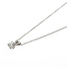 There's something classic and luxurious about a high quality single diamond hanging around your neck. This diamond solitaire pendant necklace is made from solid platinum and measures 18" long. The diamond is GIA certified as an all-natural .92ct G/VS2 round brilliant cut diamond securely set in a four prong basket style setting. This necklace comes with the GIA certificate and a free official appraisal showing the value of the necklace at $9650. Timeless Platinum Solitaire Necklace, Classic White Gold Solitaire Necklace With Diamond Accents, Timeless Silver Solitaire Necklace With Single Diamond, Formal Platinum Solitaire Necklace In Diamond White, Silver Solitaire Necklace With Brilliant Cut For Formal Occasions, Formal Diamond White Solitaire Platinum Necklace, Formal Silver Solitaire Necklace With Brilliant Cut, Classic Platinum Solitaire Necklace With Single Diamond, Timeless Platinum Solitaire Necklace With Brilliant Cut