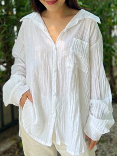 "Introducing the ultimate summer shirt that's perfect for beachwear, as a swimsuit cover, and beyond - the Muslin Double Gauze Long Sleeved Loose Fit Shirt. Made from high-quality double gauze crepe cotton material, this versatile shirt is soft, lightweight, and breathable, making it ideal for hot summer days. Fits Small, Medium and Large Front Length - 29\" Back Length - 30\" Sleeve Length - 23.5\" Bust - 44\" The loose fit design of the shirt allows for maximum comfort and freedom of movement, Summer Beach Button-up Shirt, Relaxed Fit Long Sleeve Top For Beach Cover-up, Relaxed Summer Vacation Top, Relaxed Beach Cover-up Tops, Beachwear Long Sleeve Blouse For Beach Cover-up, Beachwear Long Sleeve Blouse Cover-up, Long Sleeve Blouse For Beach Cover-up, Long Sleeve Beachwear Blouse For Beach Cover-up, White Beach Shirt For Summer