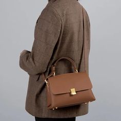 Discover Elegance and Versatility Introducing the perfect blend of style and functionality - our Soft Leather Fashion Satchel Handbag. Designed for the modern woman, this versatile shoulder tote is your ideal companion for every occasion. Whether you're stepping out for a casual coffee or heading to an important meeting, this bag adds a touch of elegance to any outfit. Exceptional Quality and Design Crafted from premium split cow leather and complemented with high-quality microfiber synthetic leather, this handbag boasts a luxurious feel and durability. The solid pattern and classic style ensure that this bag is not just a purchase, but an investment in your wardrobe. Its soft texture and sophisticated design make it a standout accessory. Practicality Meets Style This satchel isn't just ab Workwear Shoulder Bag With Adjustable Strap, Chic Brown Office Bag, Rectangular Shoulder Bag With Detachable Handle For Work, Chic Brown Flap Bag For Everyday Use, Brown Shoulder Bag With Adjustable Strap For Work, Modern Top Handle Satchel With Large Capacity, Rectangular Large Capacity Satchel For Work, Handheld Flap Bag With Carry Handle For Travel, Modern Large Capacity Top Handle Satchel