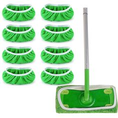 the green mop is next to eight cleaning sponges