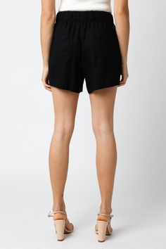 Upgrade your summer wardrobe with our Black Aretha Shorts. Made with an elastic waist for a comfortable fit and convenient pockets, these shorts are perfect for all-day wear. Stay stylish and functional with our Aretha Shorts. Fabric & fit: model is wearing size small.