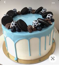 a cake decorated with cookies and oreos on top