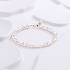 Embrace timeless grace with our Dainty Pearl White Freshwater Bracelet. Featuring delicate 4-5mm pearls, this bracelet captures a classic elegance that's both subtle and enchanting. Perfectly strung to rest effortlessly on your wrist, the small-sized pearls provide a refined touch that's suitable for any occasion. Whether worn alone or paired with other pieces, this dainty bracelet embodies pure sophistication. It's a beautiful reminder that true elegance often lies in simplicity. Pearl size 4-5 Pearl Bracelet With Pearl Charm For Formal Occasions, Delicate Pearl Drop Bracelet For Formal Occasions, Delicate Formal Pearl Bracelet, Elegant Adjustable Bracelet With Pearl Drop, Elegant Pearl Bracelet With Pearl Chain, Elegant Pearl Drop Bracelet, Dainty Pearl Bracelet For Formal Occasions, Dainty Pearl Beaded Bracelets For Formal Occasions, Dainty Pearl Chain Beaded Bracelets For Formal Occasions