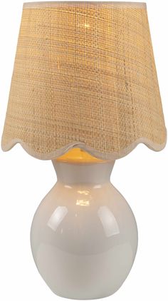 a white table lamp with a beige shade on the top and bottom part of it