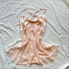 Victoria’s Secret Beautiful Peach Pink Slip Dress Size: Small Brand: Victoria’s Secret Nightie Description: Made In September Of 1999 <3 Beautiful Vintage Slip 100% Silk Extremely Rarei Have Yet To Ever See Anyone Sell This Piece Sheer Bodice Bust Area Is Double Lined With A Silky Satin Material Beautiful Rose Detailing Across The Under Bust Gorgeous Pearl Detailing In The Middle Of The Flowers Bow And Ribbon Embellishment Across The Back Deep V Back Open Back Spaghetti Straps Adjustable Straps Pink Slip Dress, Victoria Secret Dress, Vintage Slip, Fairy Cottage, Vintage Slips, Rosé Details, Victoria Dress, Silk Slip Dress, Silk Slip