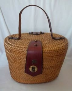 Inside is fully lined with an open slip pocket. 1960s Handbags, Vintage Exercise, Basket Handbag, Old Wicker, Historic Fashion, Large Makeup Bag, Vintage Memory, Etienne Aigner, Straw Bags