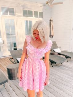 Meet the Life in the Dreamhouse Gingham Dress from Sassy Shortcake! Featuring a classic pink gingham pattern, babydoll silhouette, ruffle sleeves, and side cutouts. Show off your fun, flirty style and add a little sass to your wardrobe! Lined. Also available in blue. fit: runs true to size (model wearing a size small) Gingham Plaid Dress With Ruffles For Brunch, Cute Ruffled Strap Dresses For Picnic, Flirty Ruffled Dresses For Picnic, Gingham Dresses With Ruffles For Picnic, Gingham Dress With Ruffles For Picnic, Feminine Pink Dress For Picnic, Gingham Plaid Dress With Ruffles For Day Out, Summer Gingham Dresses With Ruffles, Feminine Ruffled Dress For Picnic