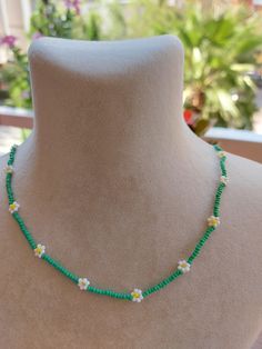 A pretty necklace perfect for everyday wear. So cute and dainty this layering necklace looks lovely on it's own on layered with other necklace. Daisy beaded necklace is an excellent and elegant gift for your lovelies. Choker necklace is made of white and green bead. You can wear the seed bead necklace to a wedding party and look very special. This tiny choker is made of glass beads. Please select necklace length from the drop-down menu or request an arbitrary length. If you would like a bigger/smaller size please contact me. You can press the contact button. Beaded Flower Necklace For Summer Gifts, Summer Beaded Necklaces With Flower Charm As Gift, Summer Flower-shaped Beaded Necklaces With Colorful Beads, Summer Flower Shaped Beaded Necklace With Tiny Beads, Summer Flower Shaped Beaded Necklaces, Colorful Flower-shaped Beaded Necklaces For Summer, Flower-shaped Colorful Beaded Necklaces For Summer, Summer Gift Beaded Necklace With Flower Charm, Cute Beaded Necklaces With Tiny Beads For Summer