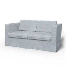 a blue couch sitting on top of a white floor