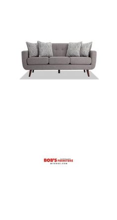 an image of a couch with pillows on the top and bottom half, in grey fabric