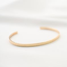 "14K gold cuff bracelet. 14K Gold Minimalist Cuff Bracelet * 14K solid gold. It is about 3mm x 1mm Please select the size of your wrist. If your wrist is 6\", please purchase 6\" bracelet. (If you order a 6\" bracelet, actual cuff length will be 5\" plus 1 inch opening.) Please read our policies before you place your order. https://www.etsy.com/shop/SashJewelry/policy?ref=shopinfo_policies_leftnav To see other Mother daughter necklace set click here: https://www.etsy.com/shop/SashJewelry?section Adjustable Matte Gold Minimalist Bracelet, Minimalist Rose Gold Bracelet With Polished Finish, Minimalist Polished Rose Gold Bracelet, Adjustable Minimalist Gold Bracelet With Polished Finish, Minimalist Open Cuff Bracelet, Minimalist Open Cuff Bangle For Everyday, Minimalist 14k Gold Cuff Bracelet Gift, Minimalist Yellow Gold Cuff Bracelet For Formal Occasions, Everyday Minimalist Open Cuff Bracelet