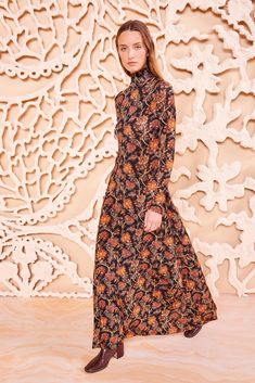 The Amari Dress has a streamlined silhouette enlivened with our paisley botanical print that’s inspired by classic French florals. Spun from our much-adored tricot jersey, this long-sleeve dress features vivid orange and red hues against a black backdrop, an elegant high turtleneck, and skims the form to a maxi length. Composition: 91% Rayon, 9% Elastane High Turtleneck, Floral Turtleneck, Nyc Boutiques, Black Backdrop, Black Backdrops, Knit Denim, Denim Accessories, Knitted Coat, Turtle Neck Dress