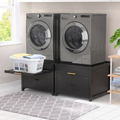 a washer and dryer sitting next to each other in a room