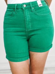 Meet your new favorite summer staple - the Judy Blue High Waist Tummy Control Kelly Green Garment Dyed Shorts. Designed with a high waist and tummy control technology, these shorts provide a flattering fit and added confidence. The vibrant kelly green color adds a pop of color to any outfit. Made from 91% Cotton, 7% Polyester, 2% Spandex FRONT RISE: 11, INSEAM: 4 / 6 (cuffed/ uncuffed) Small fits sizes: 2-4 Medium fits sizes: 6-8 Large fits sizes: 10-12 XL fits sizes: 13-15 1XL fits sizes: 14W-1 Stretch Solid Jean Shorts For Summer, Summer Biker Shorts With Built-in Shorts, Solid High-rise Jean Shorts For Summer, Solid Color High-waisted Biker Shorts For Summer, Green Bermuda Shorts With Built-in Shorts For Summer, High Waist Cotton Biker Shorts, High Waist Biker Shorts For Summer, High Waist 2-in-1 Biker Shorts For Summer, Stretch High-waisted Bermuda Shorts For Summer