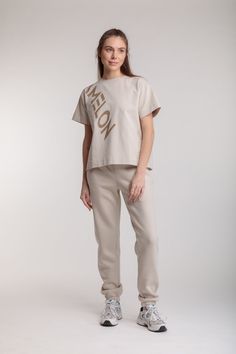 Stylish, comfortable jogger pants made from high-quality pleasant knitwear (3 thread) with a neat logo on the pocket. Pants match nicely with other items from our catalog and look good with any shoes. Size on model - S Model`s height - 176cm Beige Athleisure Sweatpants For Streetwear, Spring Cotton Joggers For Loungewear, Relaxed Fit Beige Sweatpants With Pockets, Trendy Spring Joggers, Trendy Cotton Sweatpants With Elastic Waistband, Trendy Cotton Sweatpants, Beige Relaxed Fit Sweatpants With Pockets, Trendy Cotton Bottoms For Loungewear, Trendy Cotton Loungewear Bottoms