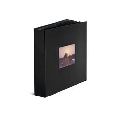 a black photo album with an image of a sunset