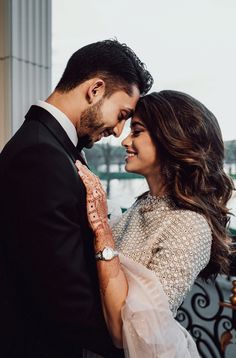 a man and woman standing next to each other