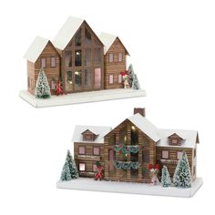 two wooden houses with christmas decorations on the front and side of each house are shown