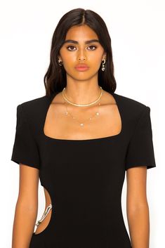 Feel chic in The Zoe Dress. Featuring a long hem, bold shoulders, and sexy side cut out with a diamond chain detail. Pair with statement jewelry and heels for the ultimate look, day or night. Glamorous Fitted Body Chain For Evening Events, Glamorous Fitted Body Chain For Evening, Evening Body Chain With Chain Strap, Chic Gold Body Chain For Evening, Chic Body Chain With Chain Strap For Night Out, Elegant Evening Dress With Chain Detail, Elegant Gold Body Chain For Night Out, Chic Gold Body Chain For Night Out, Elegant Fitted Body Chain For Parties