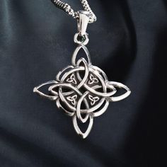 Witches knot amulet | gothic gift  Product Details:   - Pendant Size: 3.5 x 3.8 cm, designed with intricate Celtic knotwork   - Material: Durable stainless steel for long-lasting wear   - Styles: Available in 4 unique designs to suit various preferences   - Style: Gothic and Wiccan-inspired, symbolizing protection and spiritual connection   - Ideal for: Fans of mystical jewelry, Wiccan practitioners, or as a thoughtful anniversary or special occasion gift   Delivery Information:   - Processing Time: 2-5 days   - Estimated Delivery: 7-20 days, depending on location   This witches knot amulet offers a meaningful and stylish accessory for those who appreciate Celtic or Wiccan symbolism, making it a versatile gift for him or her. Witches Knot, Celtic Necklace, Mystical Jewelry, Wiccan Jewelry, Gothic Gifts, Celtic Knotwork, Gift Delivery, Style Gothic, Wire Crafts