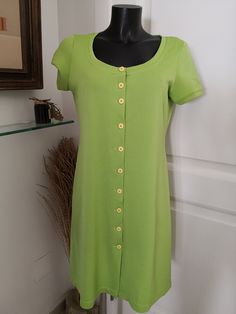 Vintage green polo style buttoned dress Size 40 FR In good condition About the size (no label), fits like a 40 FR, see the following measurements  Shoulder: 40 cm Length: 95 cm Armpit to armpit: 50 cm Polyester Here are the black store mannequin measurements: Bust: 87 cm Under bust: 74 cm Waist: 62 cm Hips: 84 cm Casual Green A-line Shirt Dress, Casual Green Midi Dress With Buttons, Green Button-up Casual Midi Dress, Casual Green Button-up Midi Dress, Fitted Green Shirt Dress With Button Closure, Casual Green Shirt Dress With Buttons, Green Knee-length Shirt Dress With Button Closure, Green Summer Midi Dress With Button Closure, Casual Green Knee-length Shirt Dress