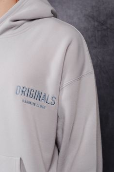 Introducing the Originals Tonal Embroidered Hoodie, part of the Originals Collection. The relaxed fit and ribbed cuffs provide a comfortable and secure fit. The embroidered Originals Logo placement on the front chest adds the right details. The fit is meant to be oversized with a relaxed body and sleeves. Style: BHMH154F Casual Embroidered Text Hoodie For Streetwear, Relaxed Fit Hoodie With Embroidered Logo For Streetwear, Oversized Cotton Hoodie With Embroidered Logo, Luxury Men's Hoodie With Embroidered Logo, Cotton Hoodie With Embroidered Graphics, Relaxed Fit, Logo Placement, Hoodie Logo, Sleeves Style, Embroidered Hoodie