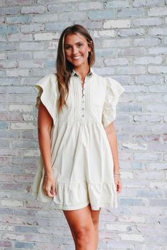 Mini dress Ruffle sleeves Quarter button up Chic Button-up Dress For Casual Occasions, Summer Feminine Ruffled Shirt Dress, Feminine Ruffled Summer Shirt Dress, Feminine Summer Shirt Dress With Ruffles, Feminine Ruffled Shirt Dress For Summer, Feminine Button-up Dress For Date Night, Chic Cotton Shirt Dress For Brunch, Spring Dresses With Pleated Short Sleeves, Casual Puff Sleeve Dress With Pleated Sleeves