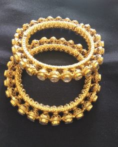 *This is Gold Finish Kundan Bangles pair.Its Perfect for Wedding Occasion as well as Unique and Ethnic Traditional Bangle to gift and Also Bridal wear to match with Wedding Outfits. *Its made from Silver n Copper mix material and 100% Handmade. *Its available in One Sizes 2,4 only.Its white kundan combination like shown in picture. *Its open able Screwed Bangles Pair. *All Kundan stones set with silver foils handsetting method and long last guarantee of its workmanship.It is White Kundan Stones Intricate Round Jhumkas For Wedding, Bollywood Style Bangle For Diwali Wedding, Wedding Jhumkas With Intricate Design, Bollywood Bangle For Wedding And Diwali, Hand Set Bollywood Style Chandbalis For Ceremonial Occasions, Wedding Round Jhumkas With Intricate Design, Intricate Design Wedding Jhumkas, Bollywood Style Wedding Bangle For Diwali, Elegant Bridal Sets With Zari Work For Ceremonial Occasion