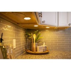 the kitchen counter is clean and ready to be used as a planter for plants