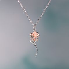 This exquisite rose pendant necklace showcases a 3D rose in 925 sterling silver with rose gold plating for a stunning flower color. It hangs delicately on a 925 sterling silver cable pendant with an adjustable ball. Make this elegant rose pendant necklace a part of your everyday fine jewelry collection, or gift it to a loved one for a special occasion. Materials: 925 sterling silverFinish: platinum plate, rose gold plateMaximum length is 17.5 inches, can be adjusted shorter using the adjustable ball. Jewelry Care: See more information about how to care for your jewelry here. Shipping Policy: Orders will be shipped within 1-3 business days. Economy shipping will take 7-14 days to arrive and standard shipping is 1- 4 days for U.S. orders. International shipping time is depended on the countr Rose Gold Flower Pendant Necklace With Clavicle Chain, Rose Gold Pendant Flower Necklace With Clavicle Chain, Rose Gold Flower Pendant Clavicle Necklace, Rose Gold Clavicle Chain Flower Pendant Necklace, Rose Gold Clavicle Chain Necklace With Flower Pendant, Rose Gold Flower-shaped Necklace As Gift For Her, Rose Gold Flower Charm Pendant Necklace, Rose Gold Flower Pendant Necklace With Roses, Rose Gold Pendant Flower Necklace