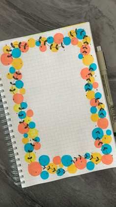 an open notebook with colorful circles on it