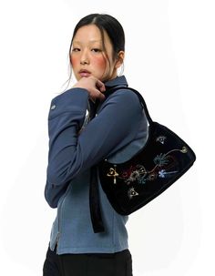 - A glossy velvet mini shoulder bag - Multicolour embroidery of KIMZISU's season motif - Length-adjustable strap - 2 inner pocketsMade in Korea COMPOSITION - BODY 1 : POLYESTER 100% - LINING 1 : NYLON 100% SIZE SPEC The model wears size OS.Model sizesHeight 176cm / Bust 31" / waist 23" / Hip 34" SIZE WIDTH HEIGHT DEPTH STRAP LENGTH OS 27 13-17 7.5 33-47.5 CARE (Check the care instructions.) Black Rectangular Velvet Bags, Black Velvet Rectangular Bags, Black Velvet Rectangular Bag, Mini Shoulder Bag, Luxury Shop, Green Bag, Beach Club, Cloth Bags, Front Row