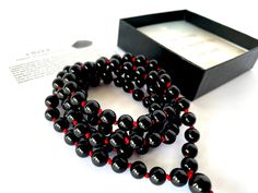 Handmade in Rochester Hills - Michigan, using only high quality natural 8MM black Onyx gemstones that are sourced ethically (and we put extra effort to keep it that way ). WATERPROOF, ADJUSTABLE and  KNOTTED between each bead.  We ship within 1-2 business days. * Gemstone: Black Onyx * Bead size: 8 mm * Circumference Length: 39 inches + 2 inches adjustable * Number of gemstones: 108 beads + 1 guru bead * Knotted * Wear this Mala as a bracelet or as a necklace. Gemstone description card included. Black Beaded Bracelet With 108 Beads For Meditation, Onyx Beaded Necklace With Black Beads As A Gift, Onyx Black Beads Necklace As A Gift, Black Onyx 8mm Beads, Black Spiritual Healing Beads, Black Beaded Bracelets With Polished Beads As A Gift, Black Gemstone Beaded Bracelets As Gift, Black Spiritual Beaded Necklaces With Polished Beads, Black Gemstone Beads For Jewelry Making