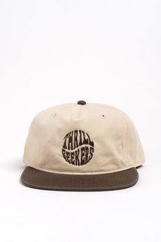 The Twist Hat offers a comfortable fit and steezy simple look. This cap's unstructured 5 panel fit makes it super duper comfy. Offered in a neutral two-tone off white / brown with the Thrill Seekers Twist logo embroidered in a matching brown. Features Mid Profile, Five Panel Cap Snapback Light-weight, Semi-Structured Fit 100% cotton construction with a plastic snapback Twist Logo, Swag Hats, Five Panel Cap, Five Panel, Simple Look, Thrill Seeker, Antique Textiles, Super Duper, Natural Brown