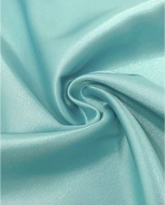 a close up shot of the fabric in aqua blue, which is very soft and silky