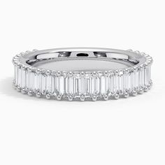 a white gold band with baguetts and diamonds