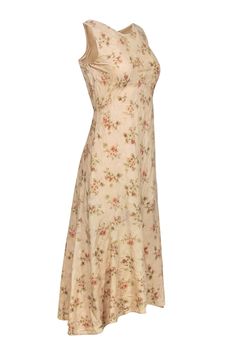 Get ready to stand out in this beige floral print dress by Ralph Lauren. Made with a luxurious blend of wool and silk, this sleeveless formal dress brings both comfort and style. Pair it with strappy sandals and dainty jewelry for a perfect look. Size 4 Shell 79% Wool, 21% Silk Lining 100% Silk Invisible side zipper Sleeveless Scoop back neckline Bust 32” Waist 29” Shoulder to hem 48” Elegant Silk Floral Dress For Garden Party, Silk Midi Dress With Floral Print And Fitted Bodice, Elegant A-line Floral Dress For Daywear, Elegant Beige Midi Dress With Floral Print, Elegant Beige Floral Print Midi Dress, Elegant Beige Floral Print Dress, Elegant Ralph Lauren Day Dresses, Elegant Beige Floral Dress For Garden Party, Elegant Ralph Lauren Spring Midi Dress